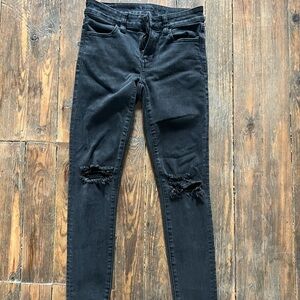 Black distressed, skinny jeans by American Eagle size 0 short
